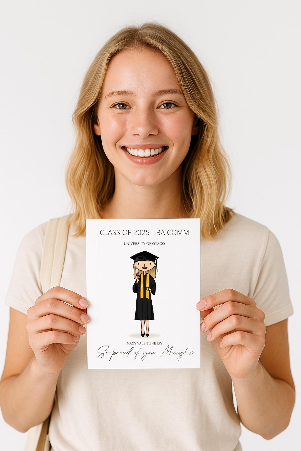 Woman holding a graduation card with a personalised portrait illustration