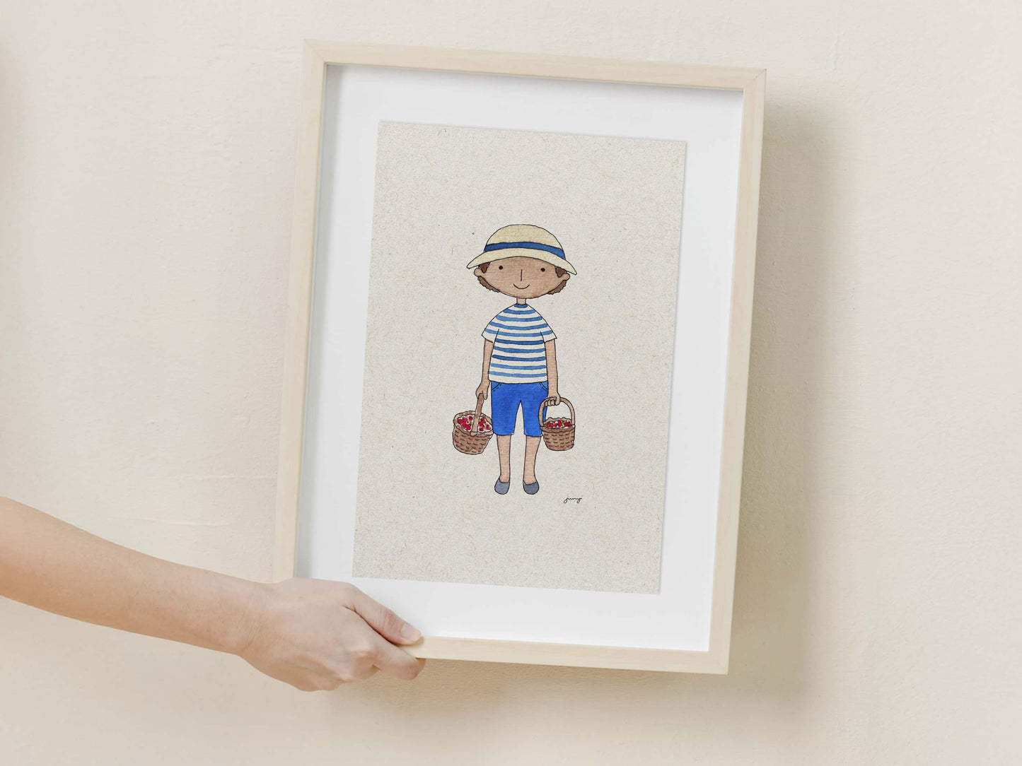 Framed illustration of a child holding flowers on a beige wall