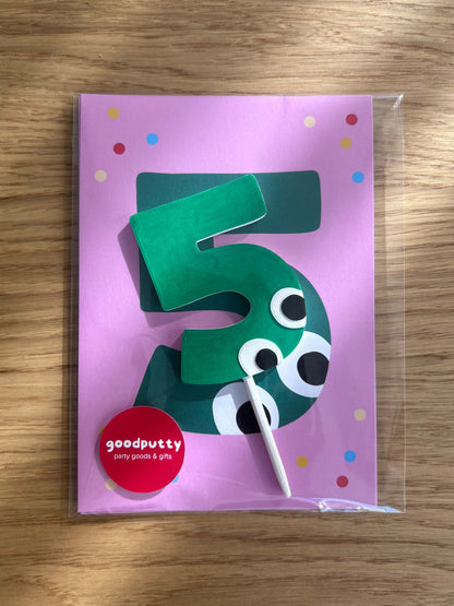 Green number 5 birthday party invitations with googly eyes on a pink card with polka dots, branded 'goodputty'.