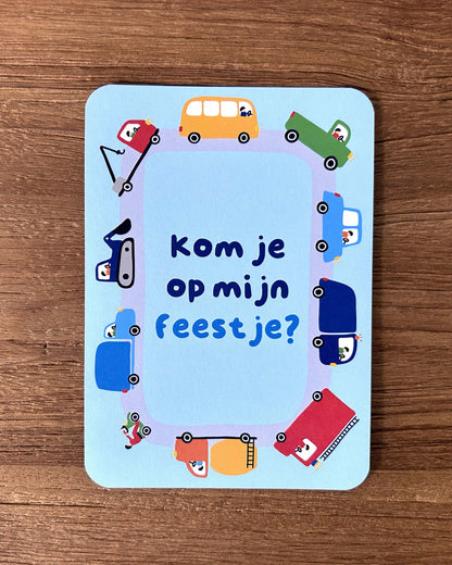 Invitation card with vehicle illustrations and text on a wooden surface