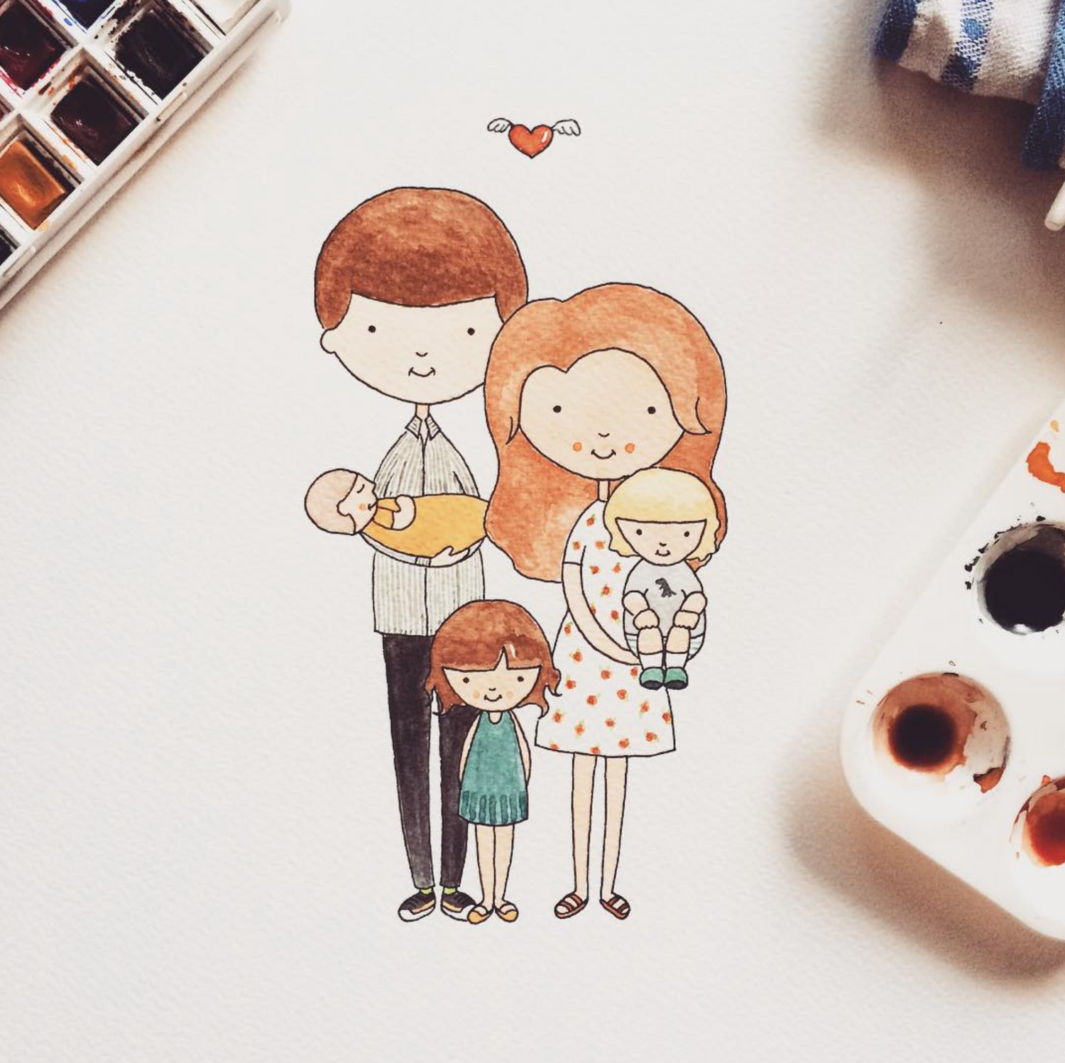 A custom watercolour portrait showing a family with three children and remembering a lost baby