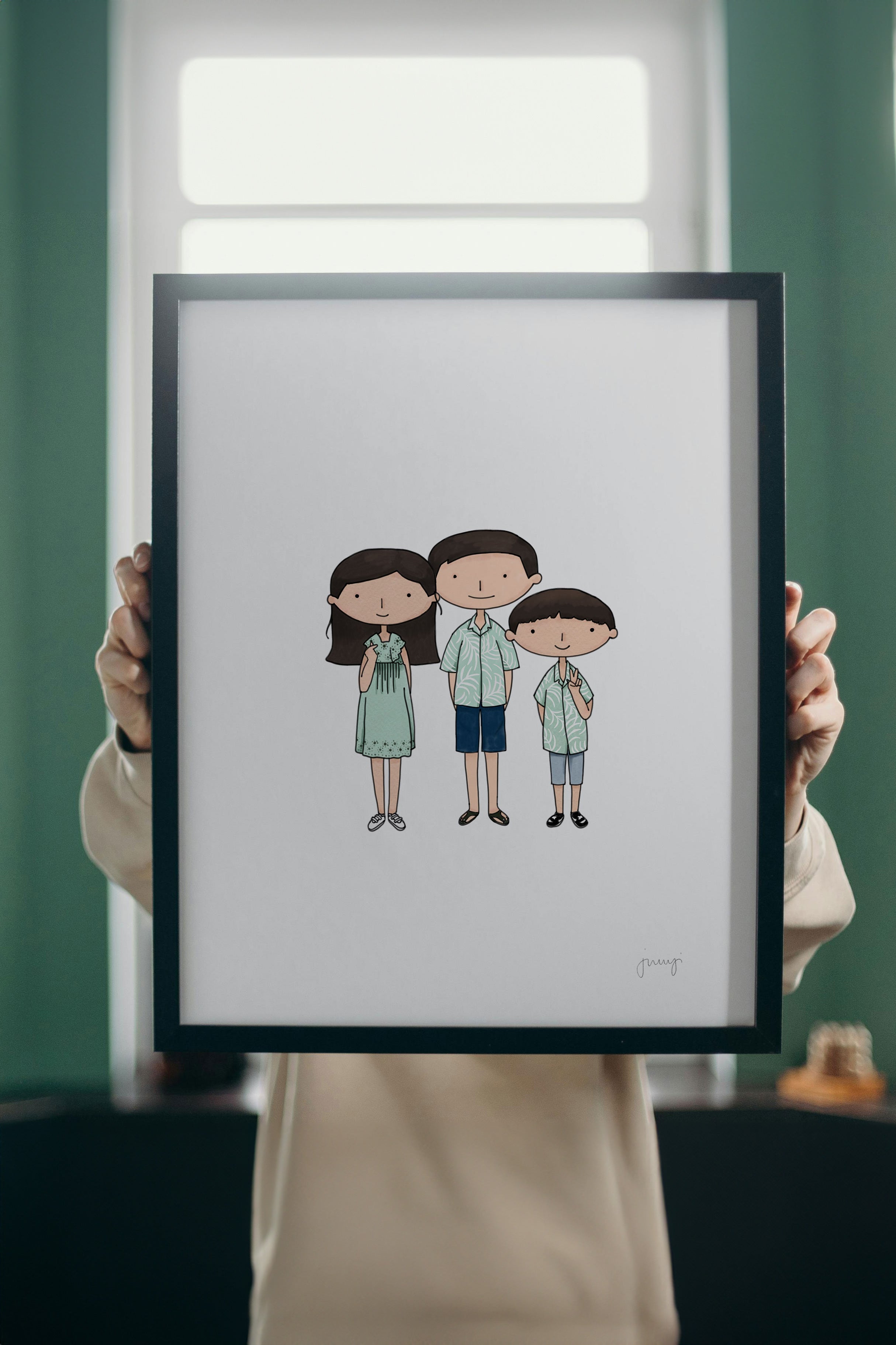 Image showing someone holding a framed portrait of three siblings
